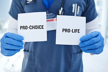 Image showing Life, choice and doctor with paper in hands for abortion, human rights or decision in clinic. Nurse, poster and vote for women with option for family planning in hospital or medical contraception