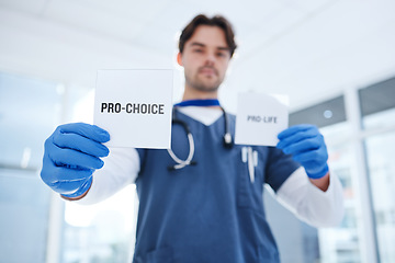 Image showing Abortion, choice and doctor with paper in clinic for human rights to pregnancy, healthcare and control of body. Nurse, decision and poster with support or vote for contraception, care and medicine