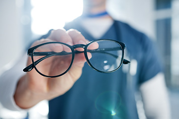 Image showing Optometry, glasses and hands of optician with frames, prescription lens and spectacles for sight. Healthcare, ophthalmology and person in clinic for eye care, vision and medical service for wellness