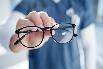 Image showing Optometry, glasses and hands of person with frames, prescription lens and spectacles for sight. Healthcare, ophthalmology and optician in clinic for eye care, vision and medical service for wellness