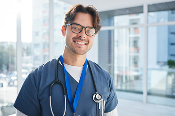 Image showing Man, doctor and hospital for healthcare, portrait and smile for career, confident and mindset. Services, medical and professional with confidence, male and work for medicare clinic, insurance and job