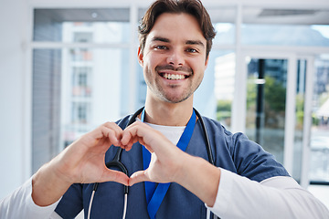 Image showing Heart in hands, hospital and portrait of doctor for support, charity and working in clinic for wellness. Healthcare, emoji and happy man with gesture for medical service, consulting and insurance