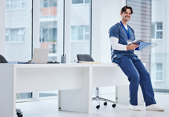 Image showing Medical folder, doctor and portrait of happy man with health results, healthcare records or clinic compliance policy. Clipboard checklist, medicine expert and surgeon smile with research portfolio