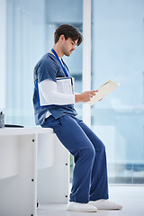 Image showing Medical folder, doctor and man reading health results, healthcare records or clinic compliance policy. Services, medicine research and profile of nurse, surgeon or expert check paperwork portfolio