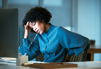 Image showing Back pain, night and business woman with burnout tired of overtime, deadline and work pressure and muscle strain. Corporate, headache and employee with stress injury working late in a company