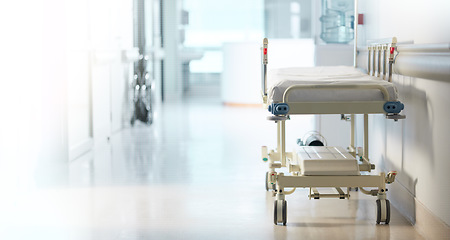 Image showing Healthcare, medical and a bed in the corridor of a hospital after work, ready for an emergency or accident. Medicine, wellness and service with a gurney in the empty hallway of a health clinic