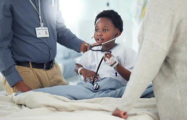 Image showing Pediatrician, mother or child with stethoscope to play in hospital for medical exam, game or lungs test. Doctor, monitor or young African boy listening to heart beat with parent or mom for wellness