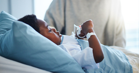 Image showing Sick black kid in hospital at bed for healthcare, recovery from virus or healing injury in pediatric clinic. Disease, illness and African child resting or patient in bedroom in medical rehabilitation