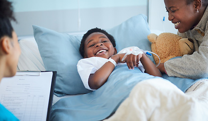 Image showing Hospital, paperwork and child with mom and doctor in bed with a smile in bedroom with happiness. Sick, kid and mother in clinic with health insurance, document or nurse with wellness checklist