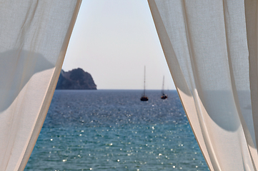 Image showing white curtains boats by the sea