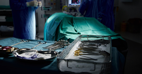 Image showing Healthcare, medical and tools for surgery in the theater of a dark hospital for an operation or procedure. Medicine, equipment and emergency treatment with surgical metal in an operating room