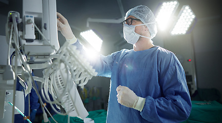 Image showing Healthcare, monitor and vital with a doctor in theater getting ready for surgery in a hospital operating room. Medical, technology and equipment with a surgeon in a clinic as a medicine professional