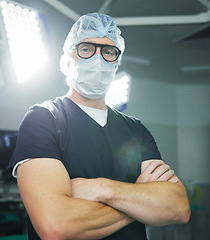 Image showing Surgeon, man or portrait in theater or confident healthcare, professional or expert help. Male person, face mask or hospital operating room or medicine support, doctor or emergency care service trust