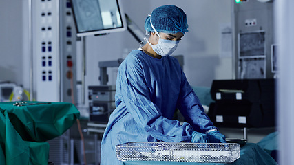 Image showing Surgery room, woman and doctor in a hospital, prepare and healthcare with safety, medicare and wellness. Person, employee and medical professional with equipment, procedure and theatre with a mask