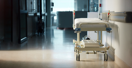 Image showing Healthcare, medicine and a bed in the corridor of a hospital after work, ready for an emergency or accident. Medical, wellness and service with a gurney in the empty hallway of a health clinic