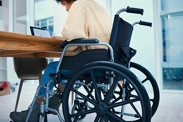 Image showing Business, desk and worker in wheelchair in office, working on project, report and inclusion. Corporate, professional and person with disability with technology for internet, research or browse online