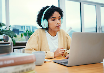 Image showing Serious, headphones and business woman on laptop working in creative startup office. Radio music, computer and professional designer planning at desk, listen to audio podcast online or reading email