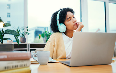 Image showing Music, headphones and meditation of business woman on laptop in startup office. Radio, relax and professional at desk listening to sound, audio and streaming podcast online for peace, calm and zen