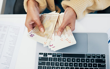 Image showing Money, hand and business woman with laptop in office for budget, savings and investment from above. Cash, counting and lady investor with payment, loan or sale, deal and profit, growth or management