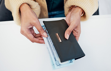 Image showing Person, hands and wallet with money for savings, investment or payment on counter at checkout. Top view or closeup of employee with cash, bills or paper notes for finance, purchase or shopping