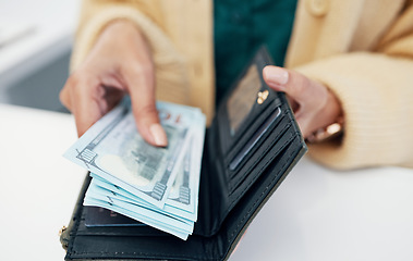 Image showing Person, hands and wallet with money for payment investment or savings on counter at checkout. Closeup of employee with cash, bills or paper notes for profit, salary or finance in purchase or shopping