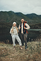 Image showing Couple, hiking and portrait in nature with travel, mountain and backpacking with wilderness and explore outdoor. People camping, adventure and holiday with anniversary date, environment and trekking