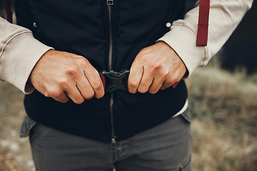 Image showing Hands, backpack strap and person hiking in nature on holiday, vacation and travel. Closeup, trekking and fasten clasp or adjust outdoor in forest, woods and countryside in preparation for adventure