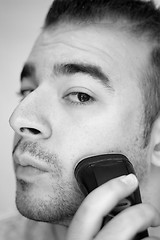 Image showing Young Man Shaving