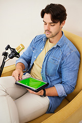 Image showing Man, tablet and green screen with mic for podcast, recording or music with mockup space on website. Talk show, online radio and chromakey touchscreen with microphone for chat, broadcast or thinking