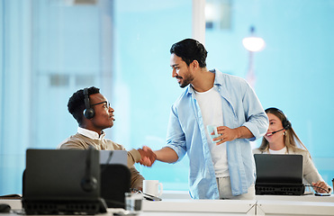 Image showing Call centre, man and handshake for teamwork in office for telecom, customer care and services. Diversity, manager and thank you for employee with headset, work and feedback on crm, web or sales