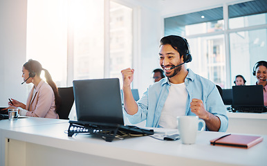 Image showing Call center, man and excited at laptop for success, CRM bonus and winning promotion in coworking agency. Asian salesman celebrate achievement of online deal, telemarketing profit and yes with fist