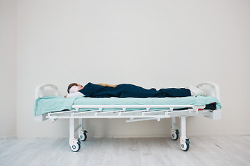 Image showing Doctor, sleeping and break on hospital bed, tired and burnout from healthcare service, overworked and exhausted. Nurse, woman and rest with fatigue, shift and stress for nap, relaxing and employee