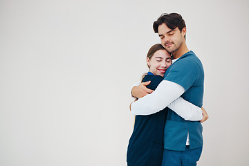 Image showing Doctor, colleagues and hug smile at healthcare clinic, support or work stress. Medical professionals, friends or helping comfort in scrubs or wall background, mockup space or happy trust at hospital