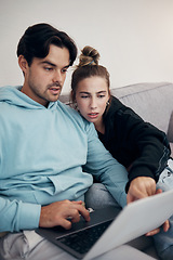 Image showing Laptop, stress and couple pointing in home living room for budget planning, taxes or debt. Computer, man and frustrated woman on sofa for finance, asset management and mortgage, loan and rent bills