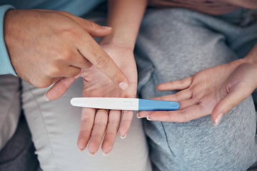 Image showing Hands, couple and closeup of pregnancy test, results and waiting for news together in home. Top view, kit and pregnant woman and man family planning for future maternity, ivf fertility and support