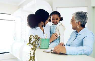 Image showing Mother, daughter and pediatrician in a clinic for insurance, healthcare checkup or medical appointment. Family, doctor and a girl child in the hospital with a mature medicine professional for health