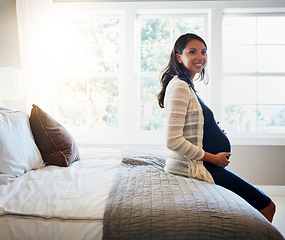 Image showing Home bedroom, happiness and woman pregnancy, massage stomach, abdomen or mom happy for baby development. Mama expectation, bed and pregnant mother smile, maternity and hope for future life growth