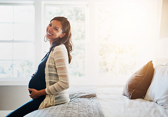 Image showing Bedroom, happiness and home portrait of pregnant woman holding stomach, abdomen or belly with love, care and baby support. Pregnancy, bed and person smile, maternity and hope for future life growth