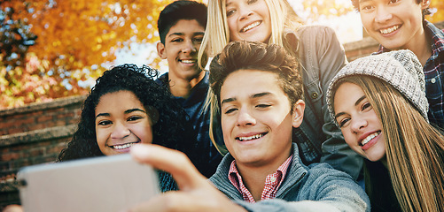 Image showing Smile, friends and a selfie in nature for bonding, fun and video call in autumn. Happy, together and diversity of kids taking a photo on technology in a park for social media or live streaming