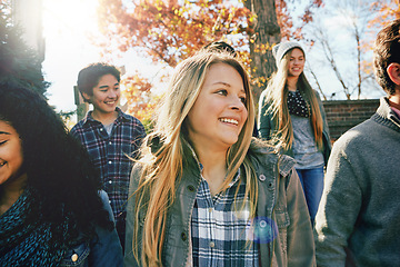 Image showing Walking, teenager and talking with friends in park, nature or social group outdoor together with diversity. Happy, teens or kids relax in fall with a joke, best friend or conversation in community