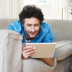 Image showing Man, comfort and tablet internet on couch for digital contact, social media or movie app. Male person, streaming film and online shop connection or connectivity fun for relaxing, weekend joy on sofa