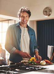 Image showing Smile, portrait and man chop vegetables in the kitchen for diet, healthy or nutrition dinner. Happy, cooking and mature male person from Canada cutting ingredients for a supper or lunch meal at home.