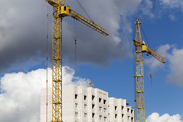 Image showing construction cranes with construction equipment