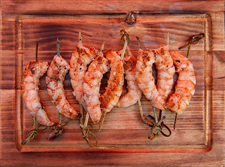 Image showing A professional cook prepares shrimps