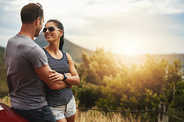 Image showing Romantic, love or happy couple in nature for date, support or care on a summer park adventure. Smile, hug or man with woman on outdoor holiday vacation together in park for bond, travel or romance