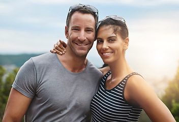 Image showing Portrait, hug and couple with adventure, outdoor and lens flare with happiness, love and wellness with fun. Face, man carrying woman or journey with hiking, smile and outside with freedom and embrace