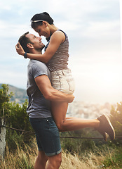 Image showing Love, lift or happy couple hug in park for date or care in nature with support, bond or freedom. Eye contact, romantic man or woman excited by holiday vacation together to celebrate, relax or travel