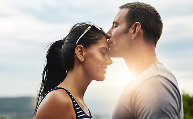 Image showing Forehead, love or couple kiss on outdoor date, wellness or care on summer romance or adventure. Peace, smile or man with happy woman on holiday vacation together to bond, support or relax in nature