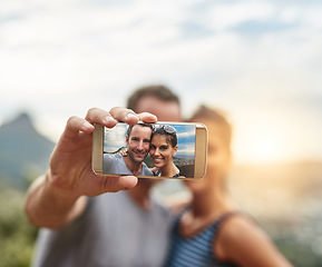 Image showing Phone screen, selfie and portrait of happy couple in nature outdoor on summer vacation together. Smartphone, face and picture of man and woman in park for connection, memory of love and relationship