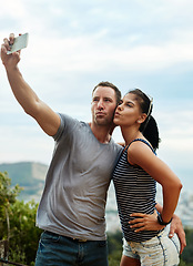 Image showing Air kiss, selfie and couple in nature outdoor for freedom on summer vacation together. Romantic man, woman and picture in countryside for connection, love memory or healthy relationship on adventure